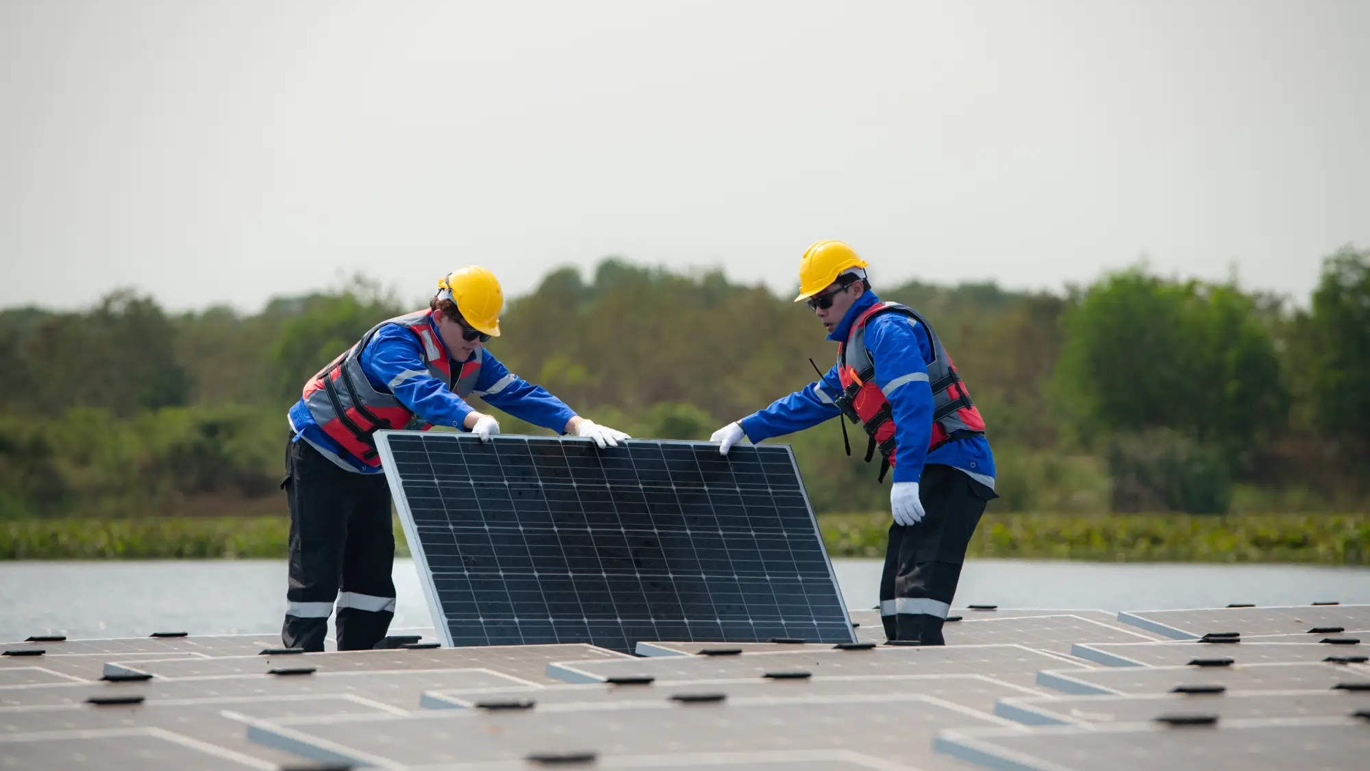 photovoltaic-engineers-work-on-floating-photovolta-2024-02-12-18-54-43-utc